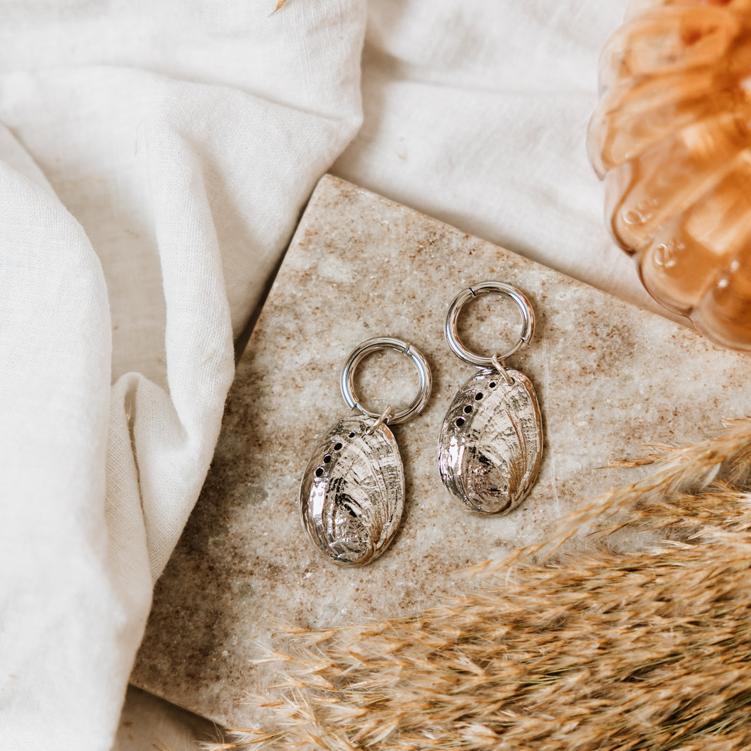 Silver hoops with abalone shell charm